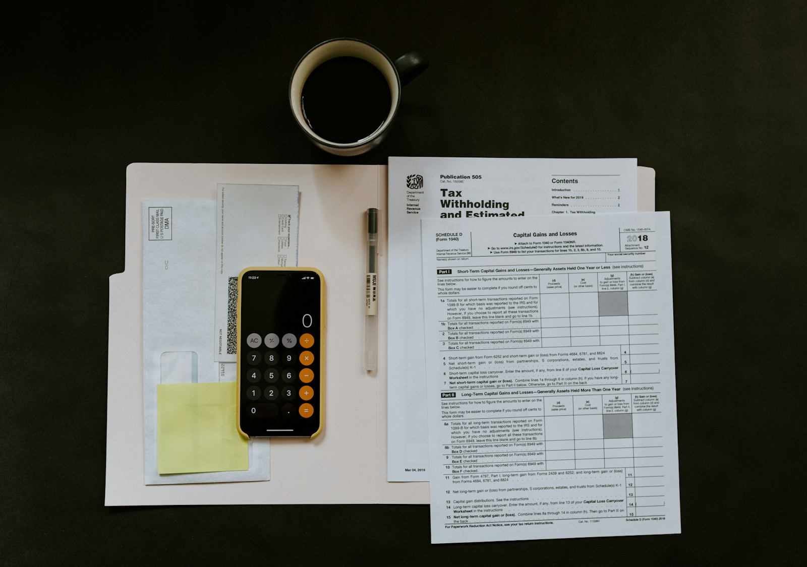 Financial paperwork and a calculator on a desk representing fee review and payment tracking